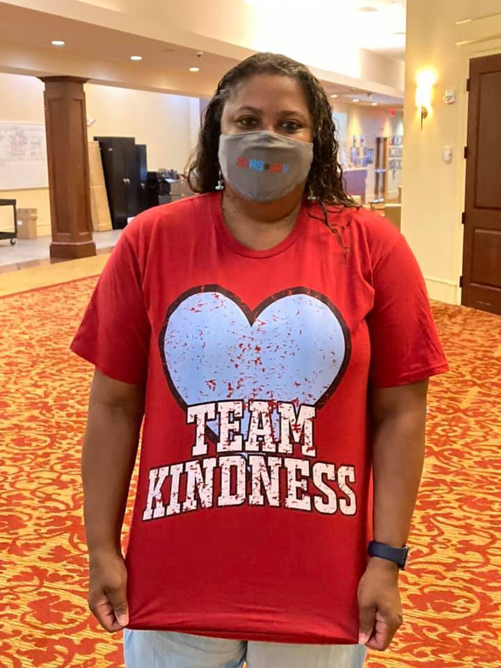 Teacher wears "Team Kindness" shirt
