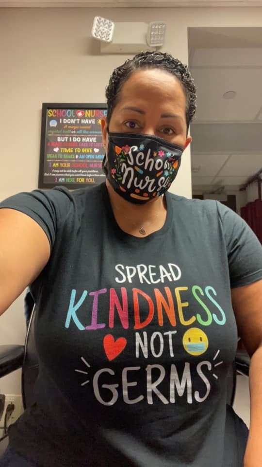Teacher wears "Spread Kindness, not germs" shirt