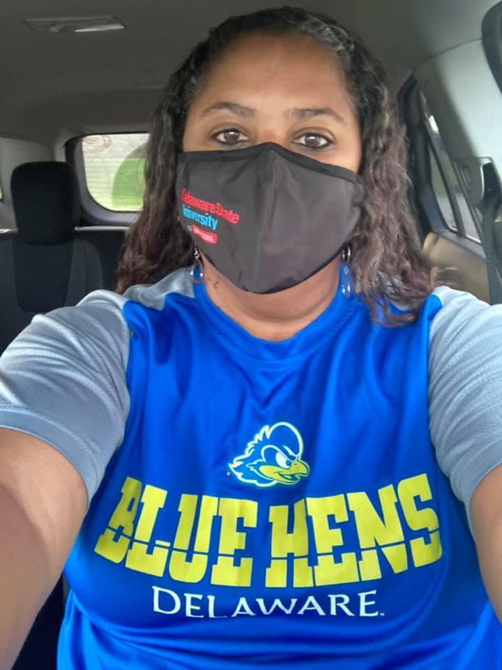 Faculty member sporting Blue Hens alum gear